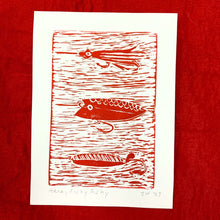 Example of red colour option for the Here Fishy, Fishy print. Print shows three types of lures.